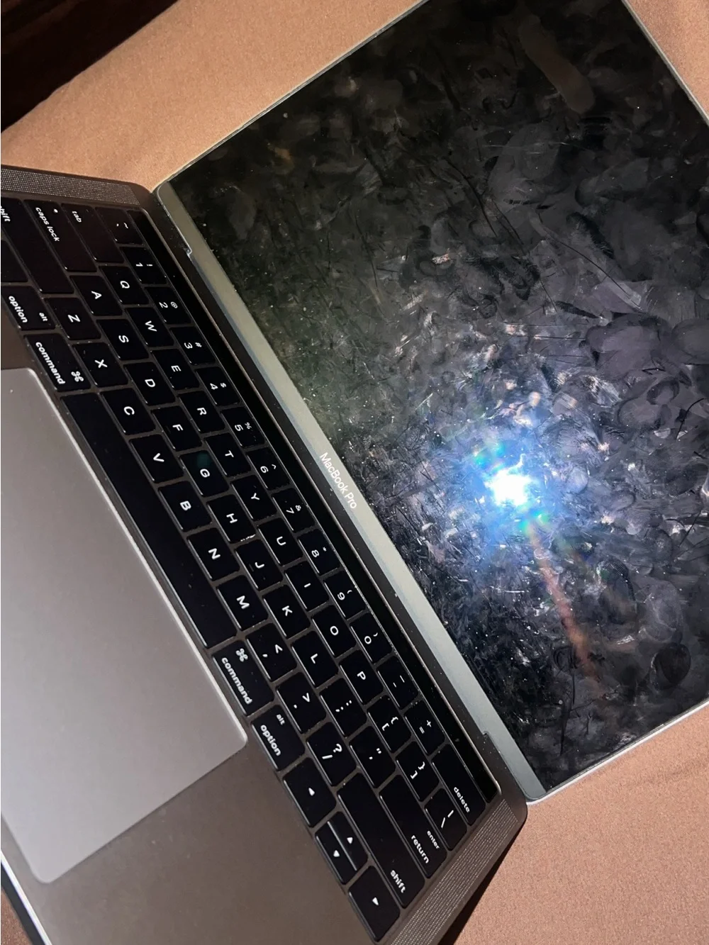Apple MacBook Laptop in Silver with Black Apple Logo